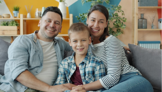 Happy family smiling together at home
