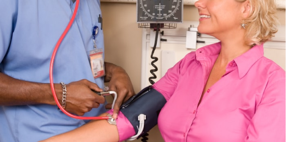 Nurse providing attentive care to a patient at home